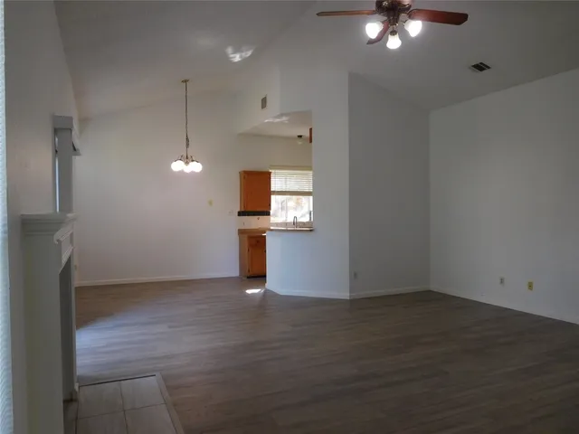 wooden floor in an empty room with a cabinet