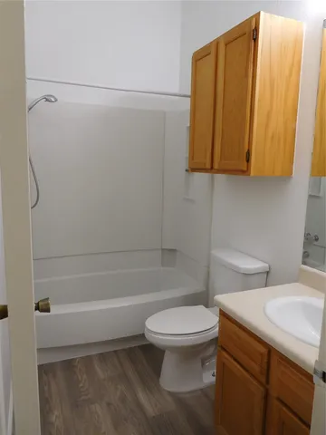 a view of an empty room and wooden floor