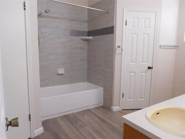 a bathroom with a bathtub and a shower