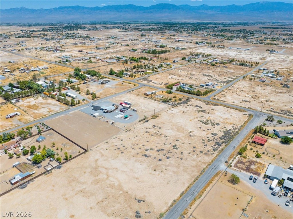 4610 Lawrence Road Pahrump, NV 89048 - Photo 40 of 42 An aerial perspective reveals sprawling rural landscapes with distant mountains.