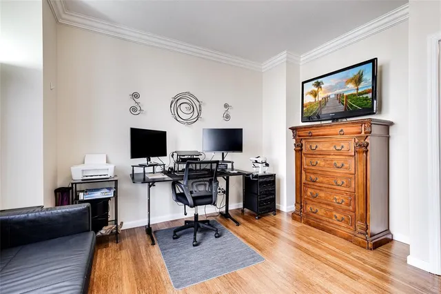 a living room with furniture and large windows