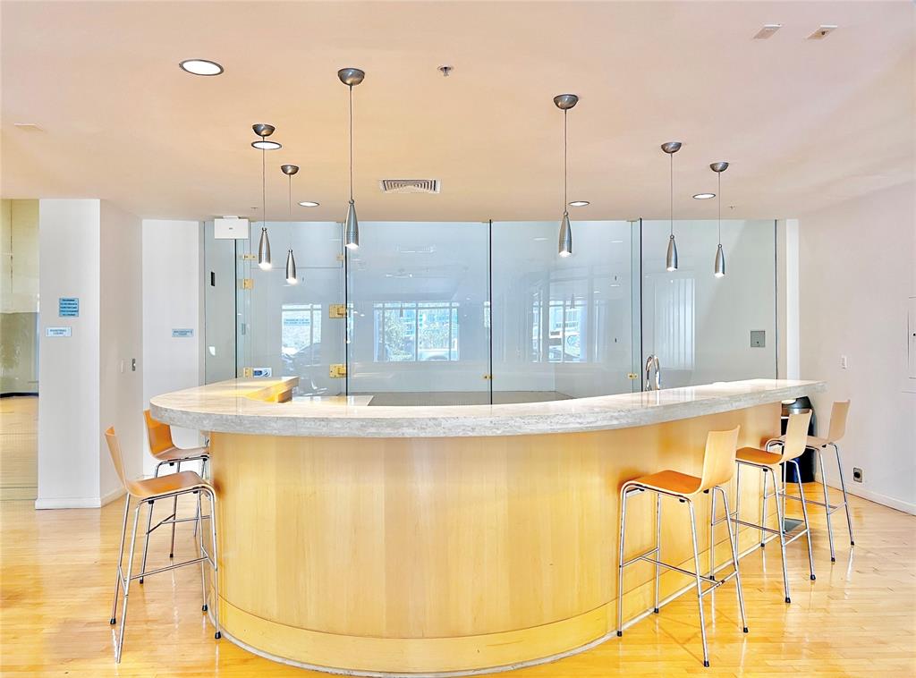 511 Southeast 5th Avenue, Unit 1022 Fort Lauderdale, FL 33301 - Photo 45 of 67 a view of a kitchen with a table and chairs