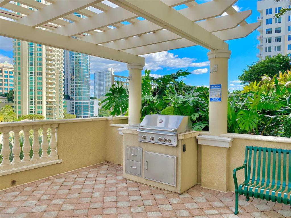 511 Southeast 5th Avenue, Unit 1022 Fort Lauderdale, FL 33301 - Photo 56 of 67 a view of a patio with a table and chairs