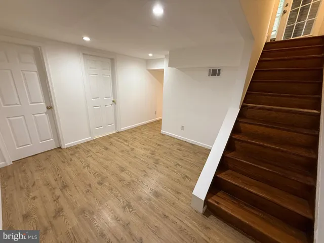 a view of entryway with wooden floor