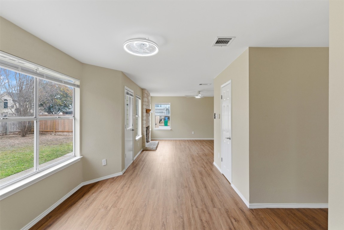 3900 Lemos Drive Austin, TX 78728 - Photo 12 of 35 a view of a big room with wooden floor and windows