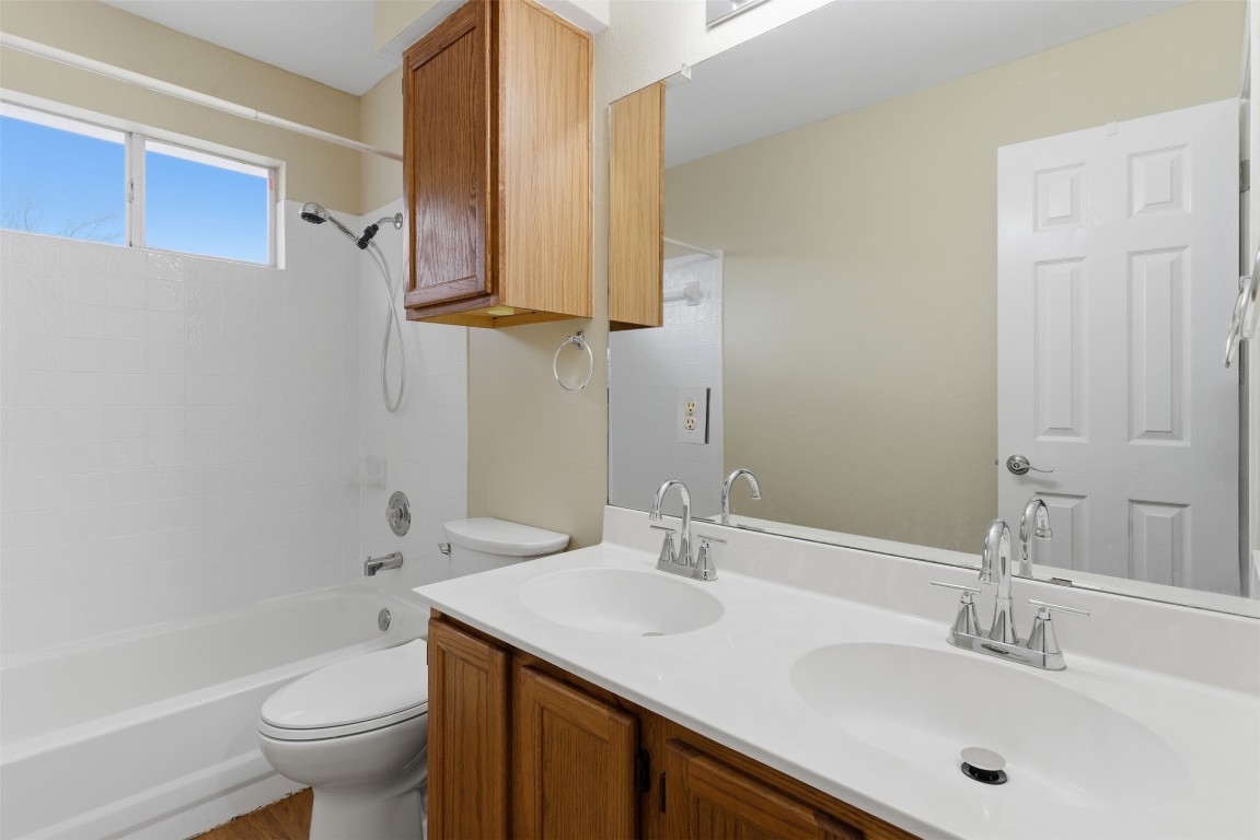 3900 Lemos Drive Austin, TX 78728 - Photo 17 of 35 a bathroom with a sink toilet and shower