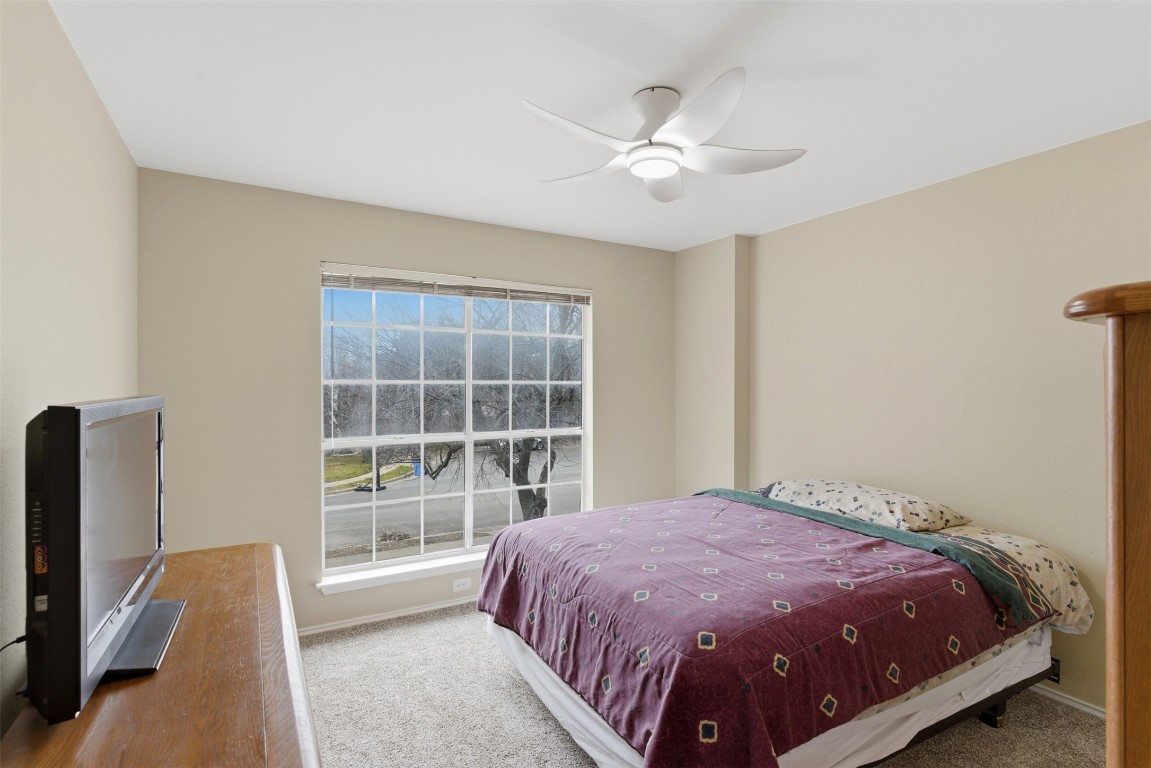 3900 Lemos Drive Austin, TX 78728 - Photo 20 of 35 a bed sitting in a room next to a window