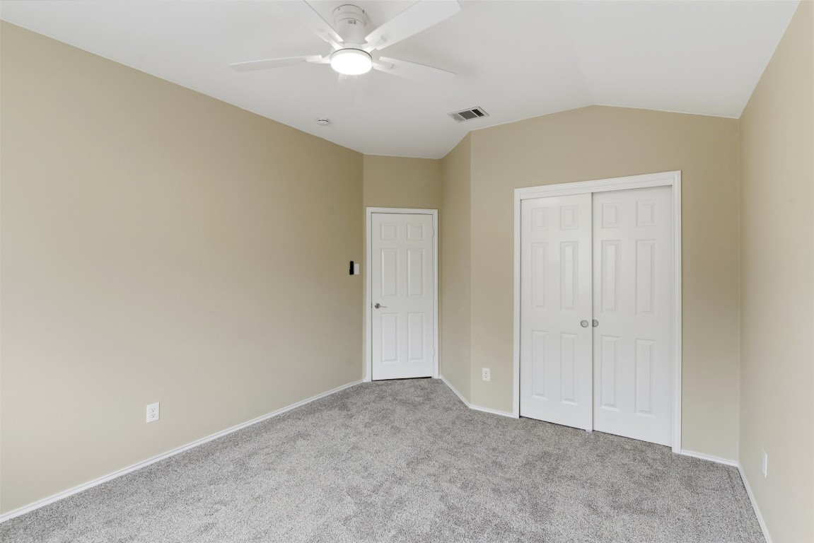3900 Lemos Drive Austin, TX 78728 - Photo 23 of 35 a view of an empty room and a ceiling fan