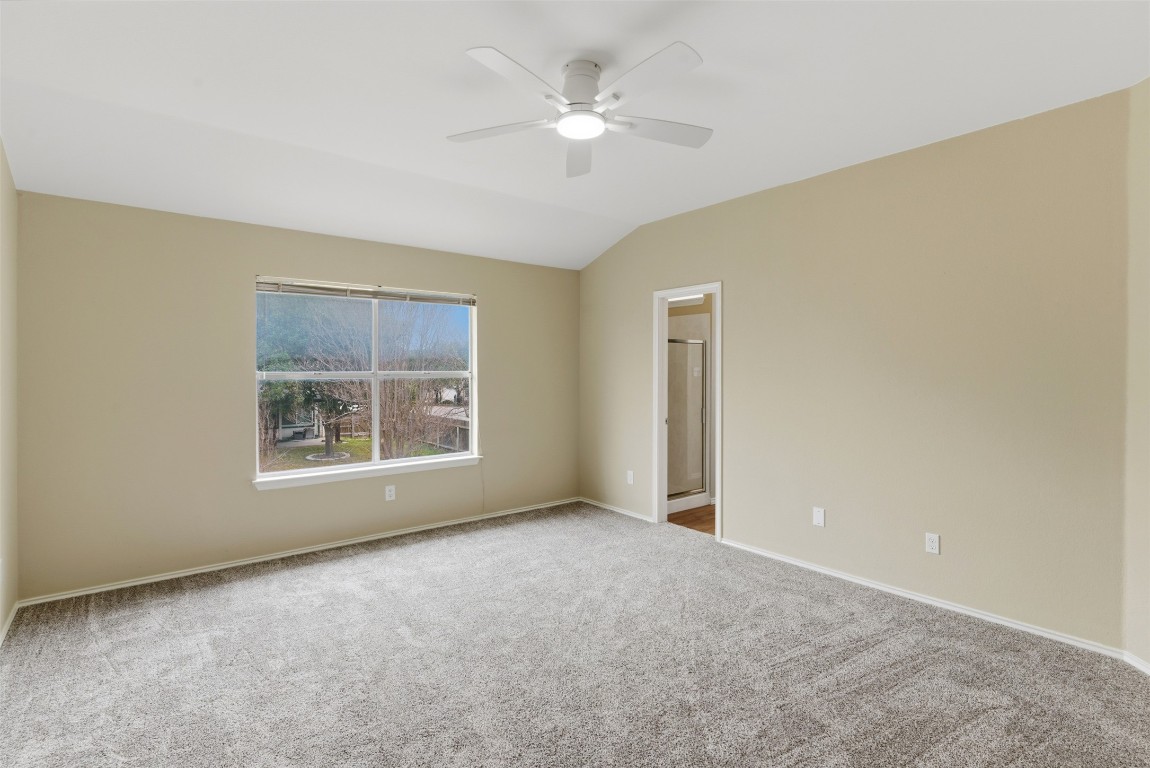 3900 Lemos Drive Austin, TX 78728 - Photo 24 of 35 an empty room with windows and ceiling fan