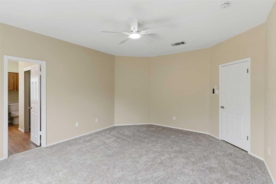 3900 Lemos Drive Austin, TX 78728 - Photo 25 of 35 a view of a room with a ceiling fan