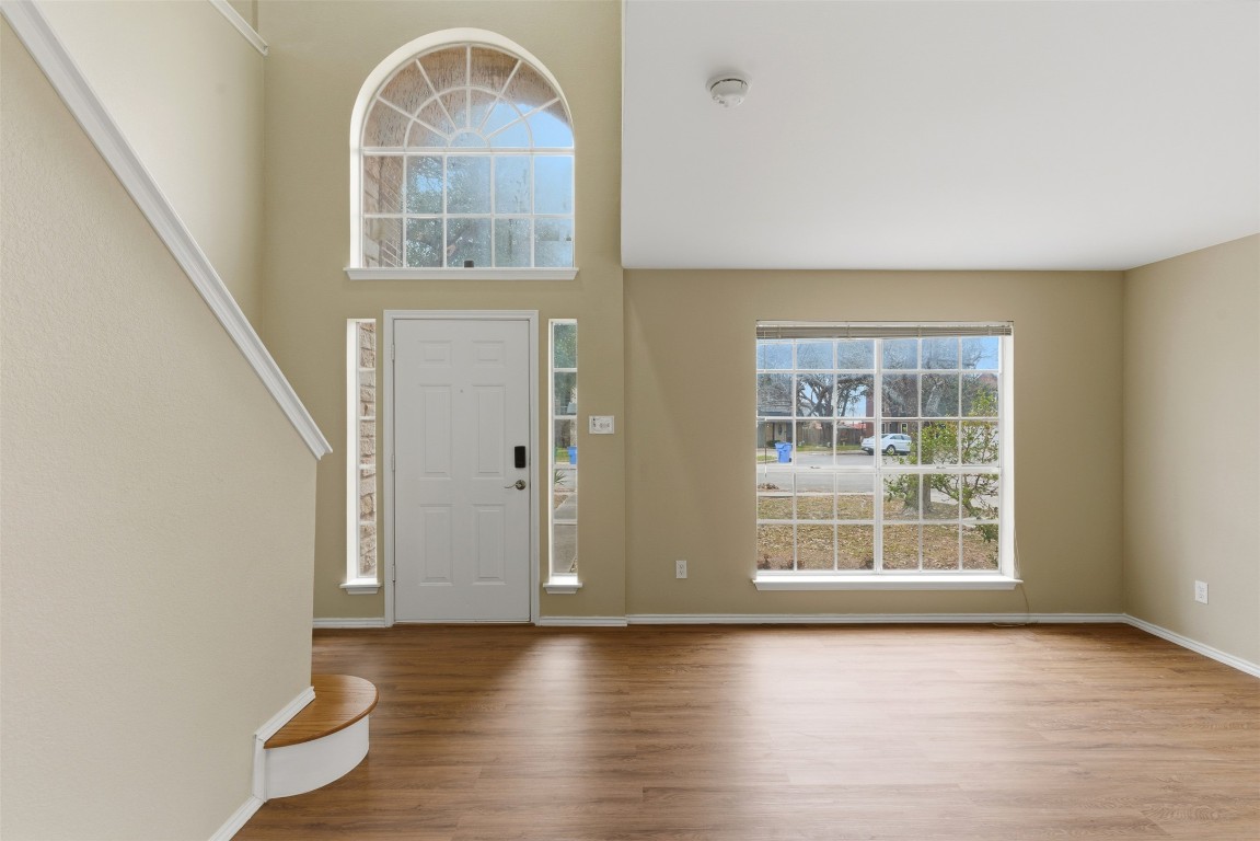 3900 Lemos Drive Austin, TX 78728 - Photo 8 of 35 an empty room with wooden floor and windows