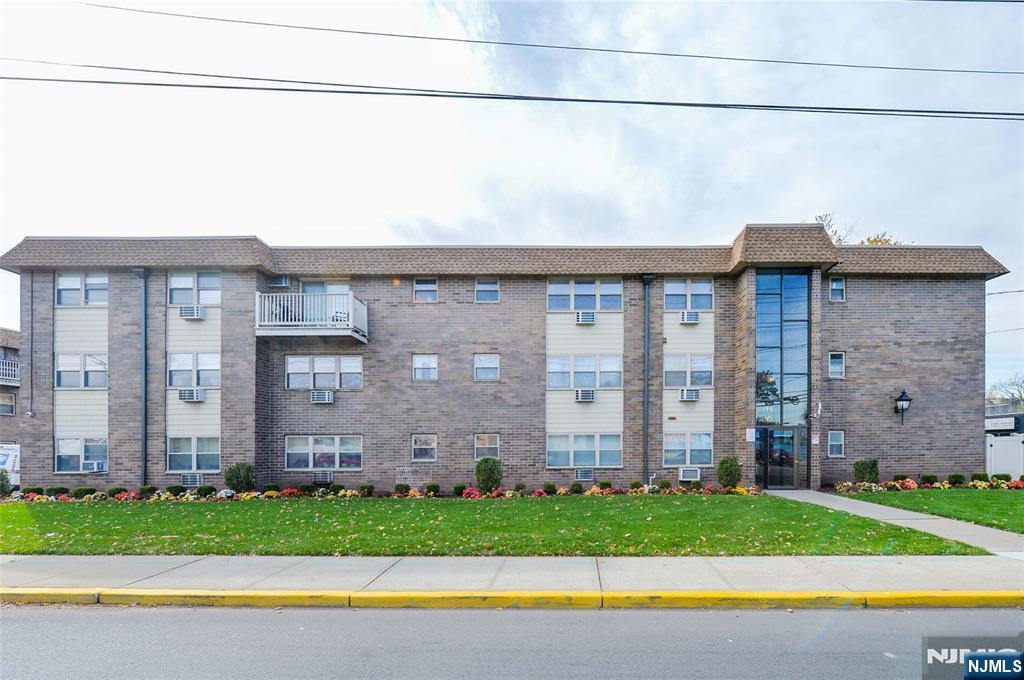 a view of a house with a yard and plants