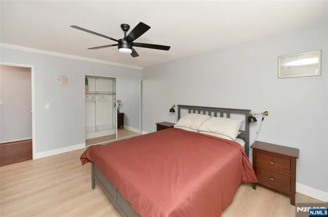 a bed room with a bed and a chandelier