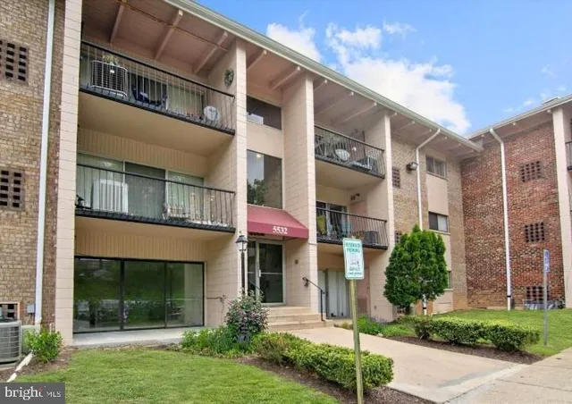 a view of a building with a yard