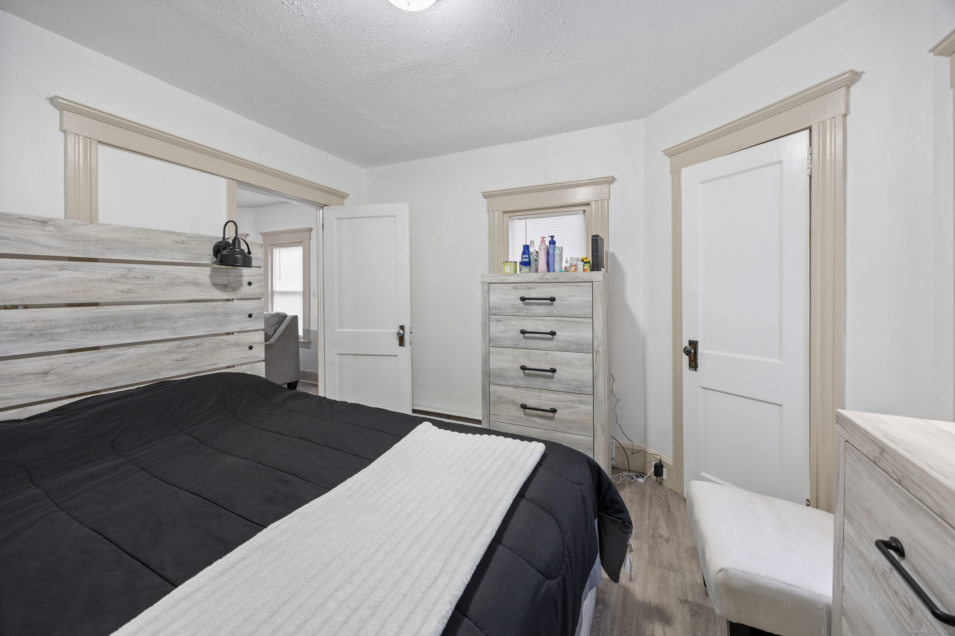 29 Berry Street Torrington, CT 06790 - Photo 11 of 31 a bedroom with a bed and a cabinets