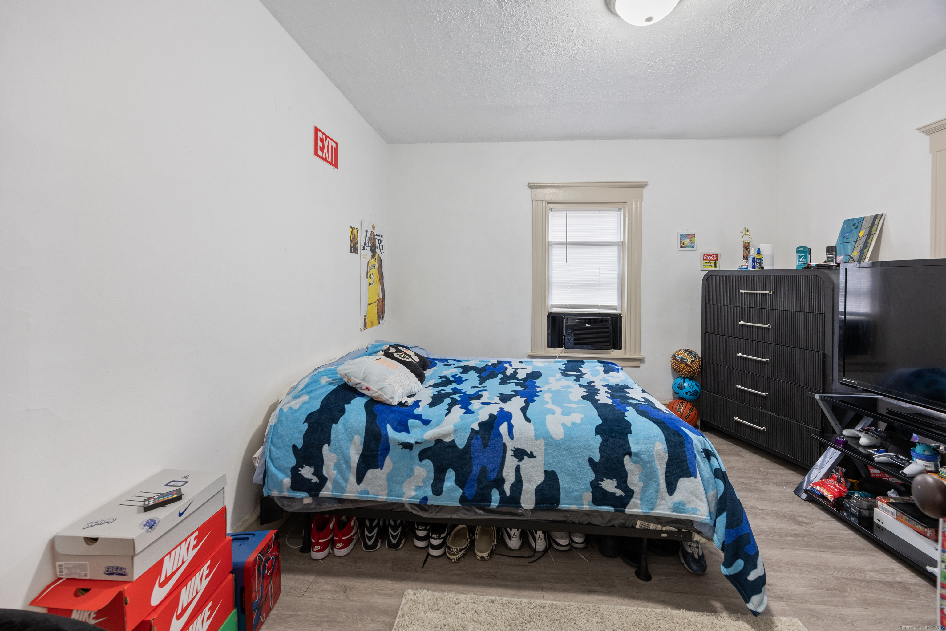 29 Berry Street Torrington, CT 06790 - Photo 12 of 31 a bedroom with a bed and a dresser