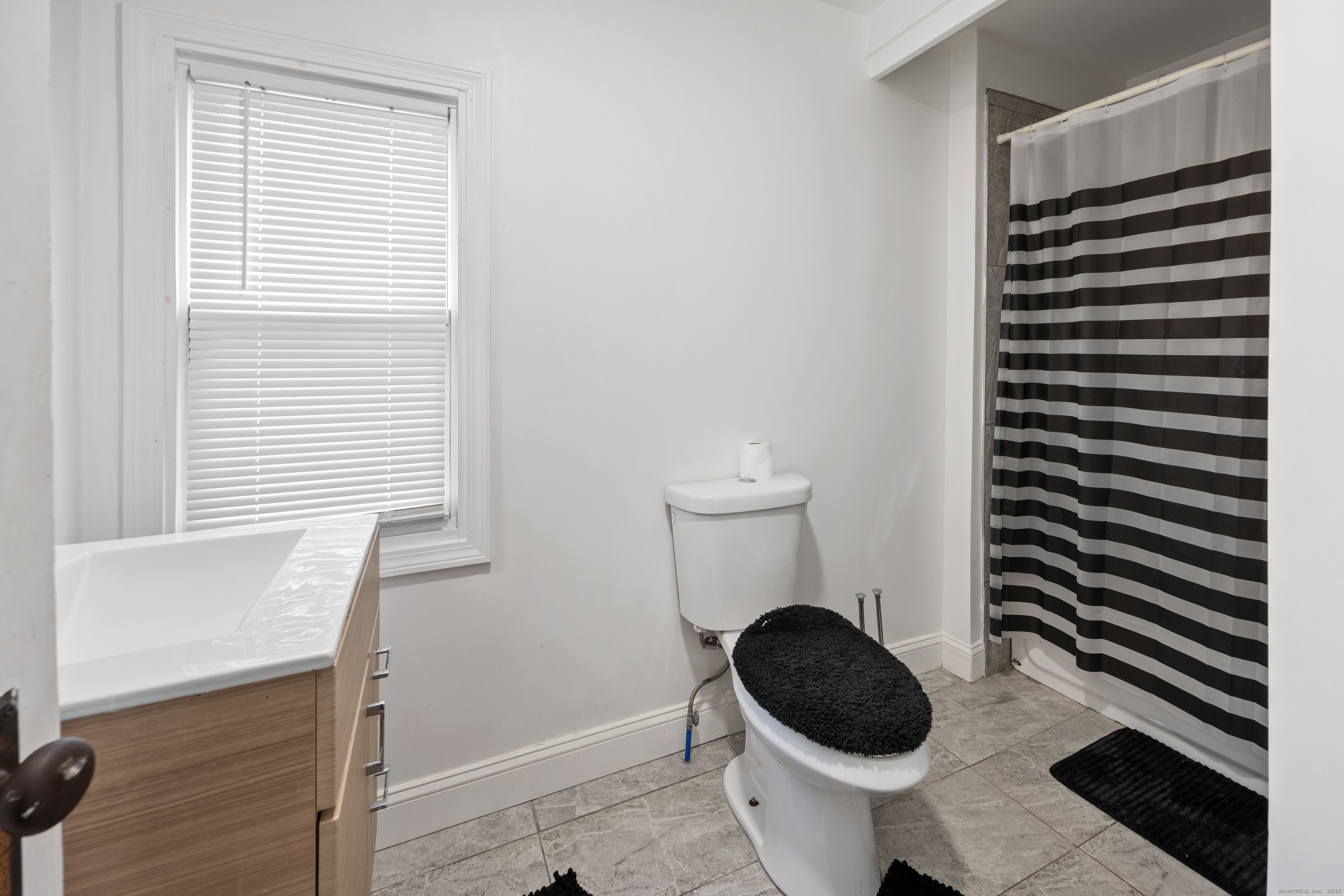29 Berry Street Torrington, CT 06790 - Photo 14 of 31 a bathroom with a toilet and a window
