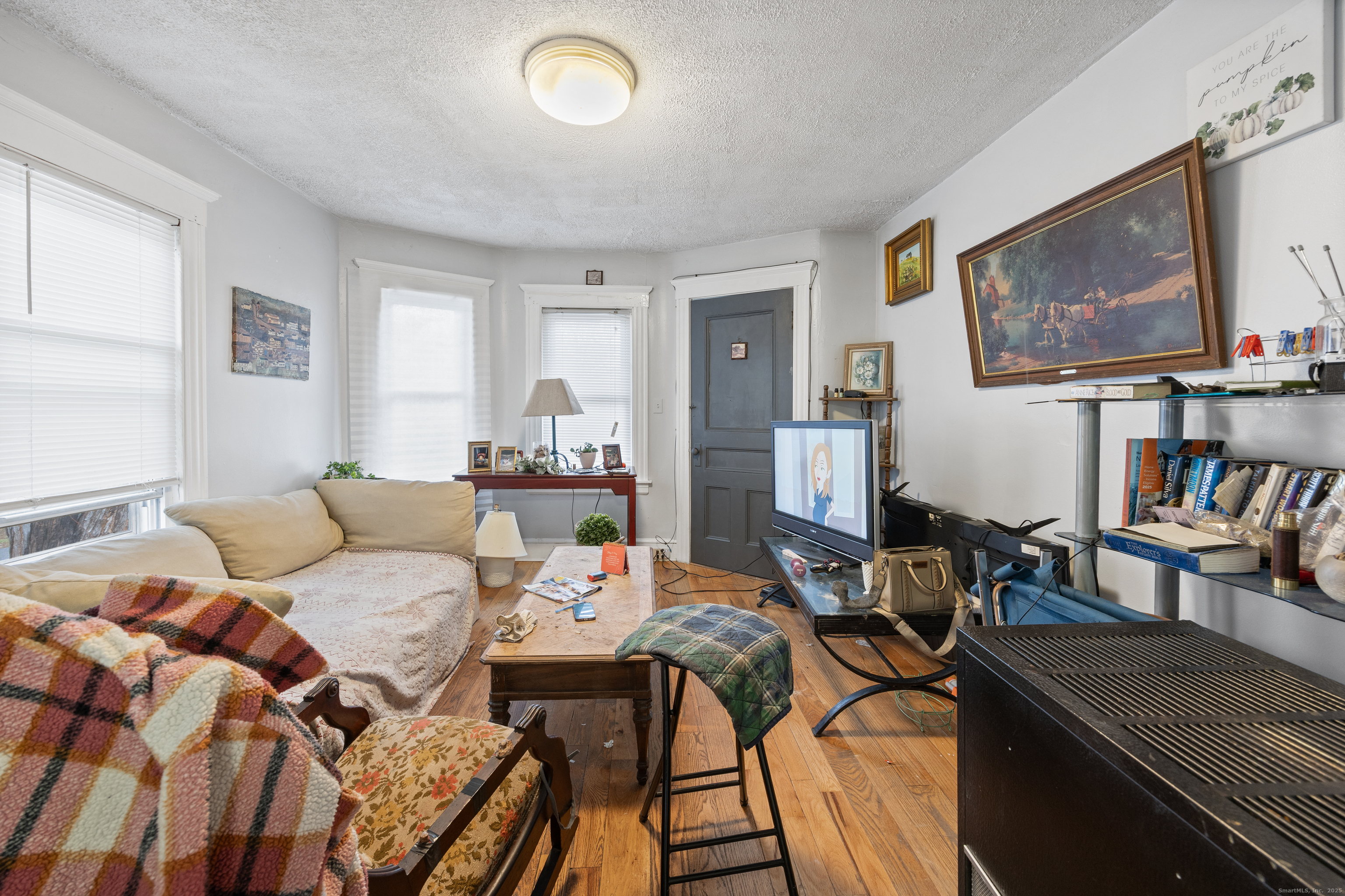 29 Berry Street Torrington, CT 06790 - Photo 15 of 31 a living room with furniture and a flat screen tv