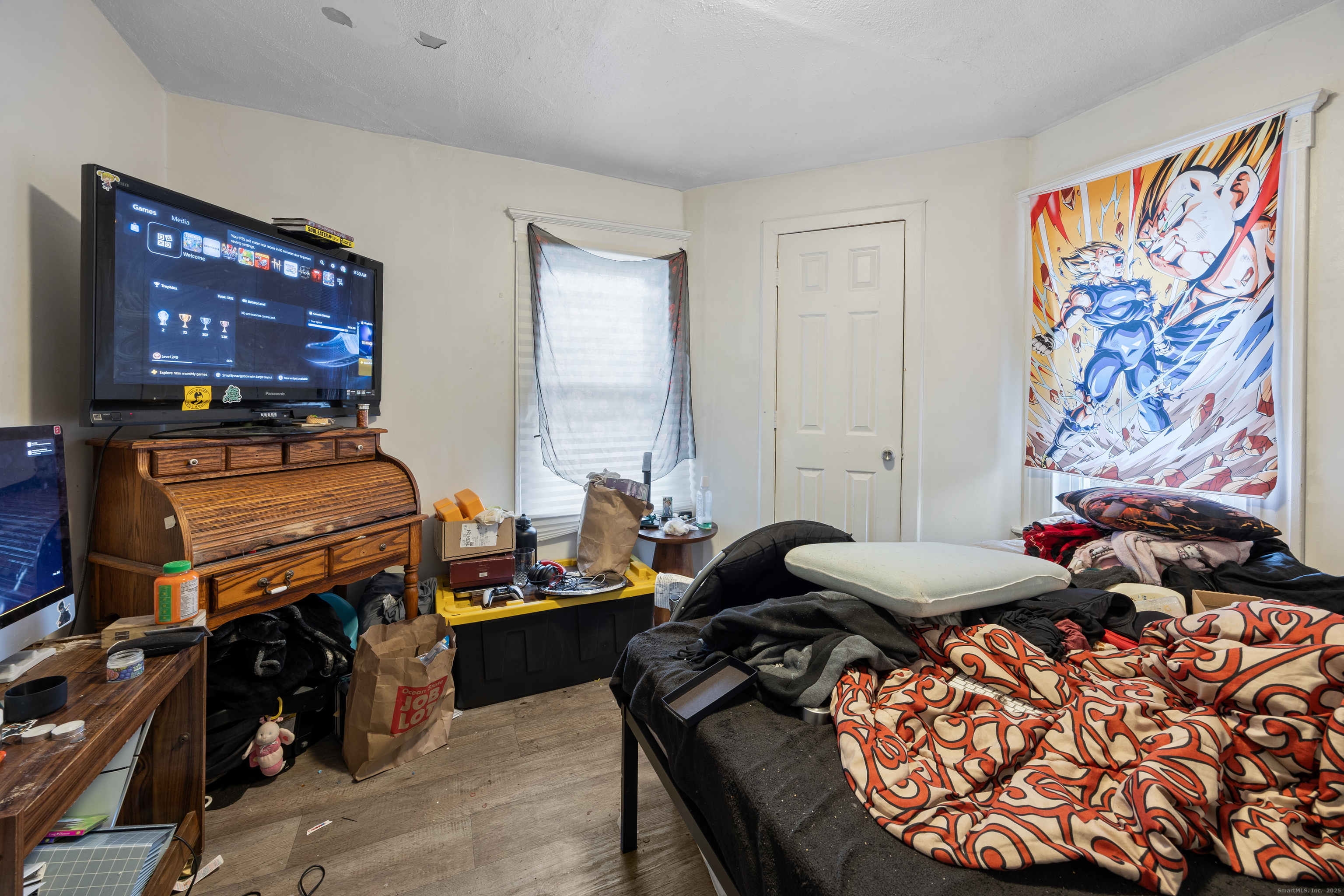 29 Berry Street Torrington, CT 06790 - Photo 18 of 31 a bedroom with furniture and a flat screen tv