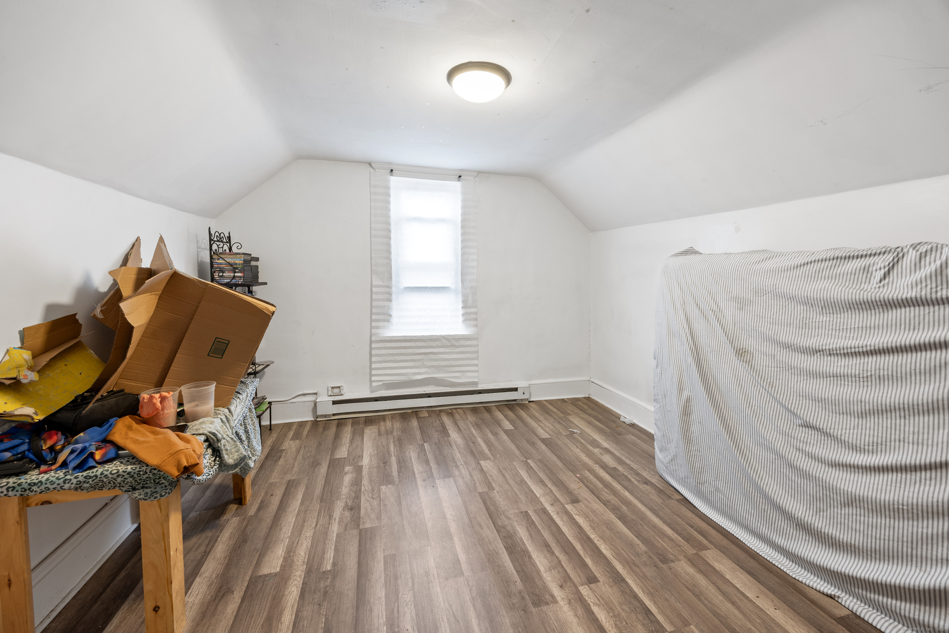 29 Berry Street Torrington, CT 06790 - Photo 20 of 31 a view of room with wooden floor and fan