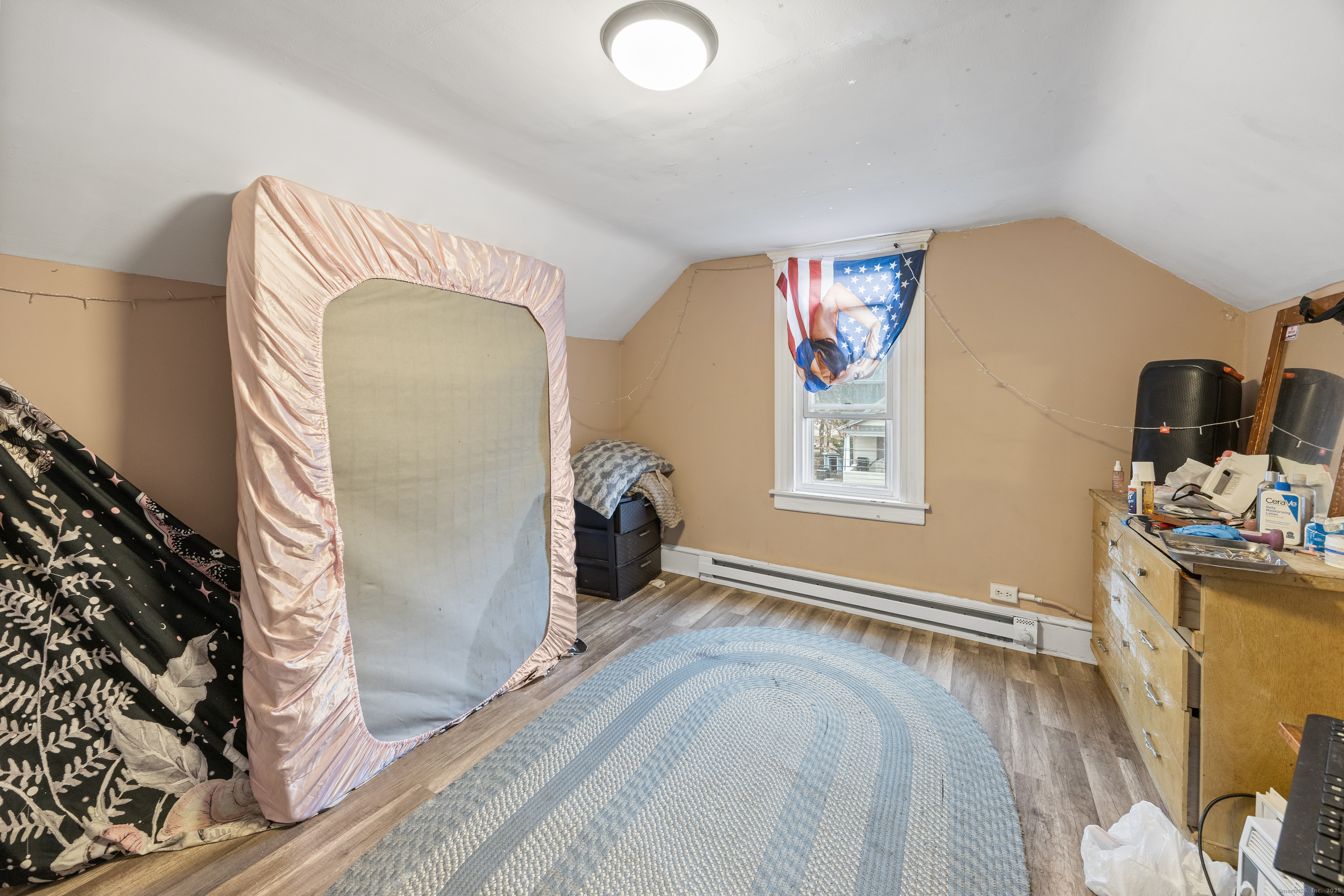 29 Berry Street Torrington, CT 06790 - Photo 22 of 31 a bedroom with a bed and a flat screen tv