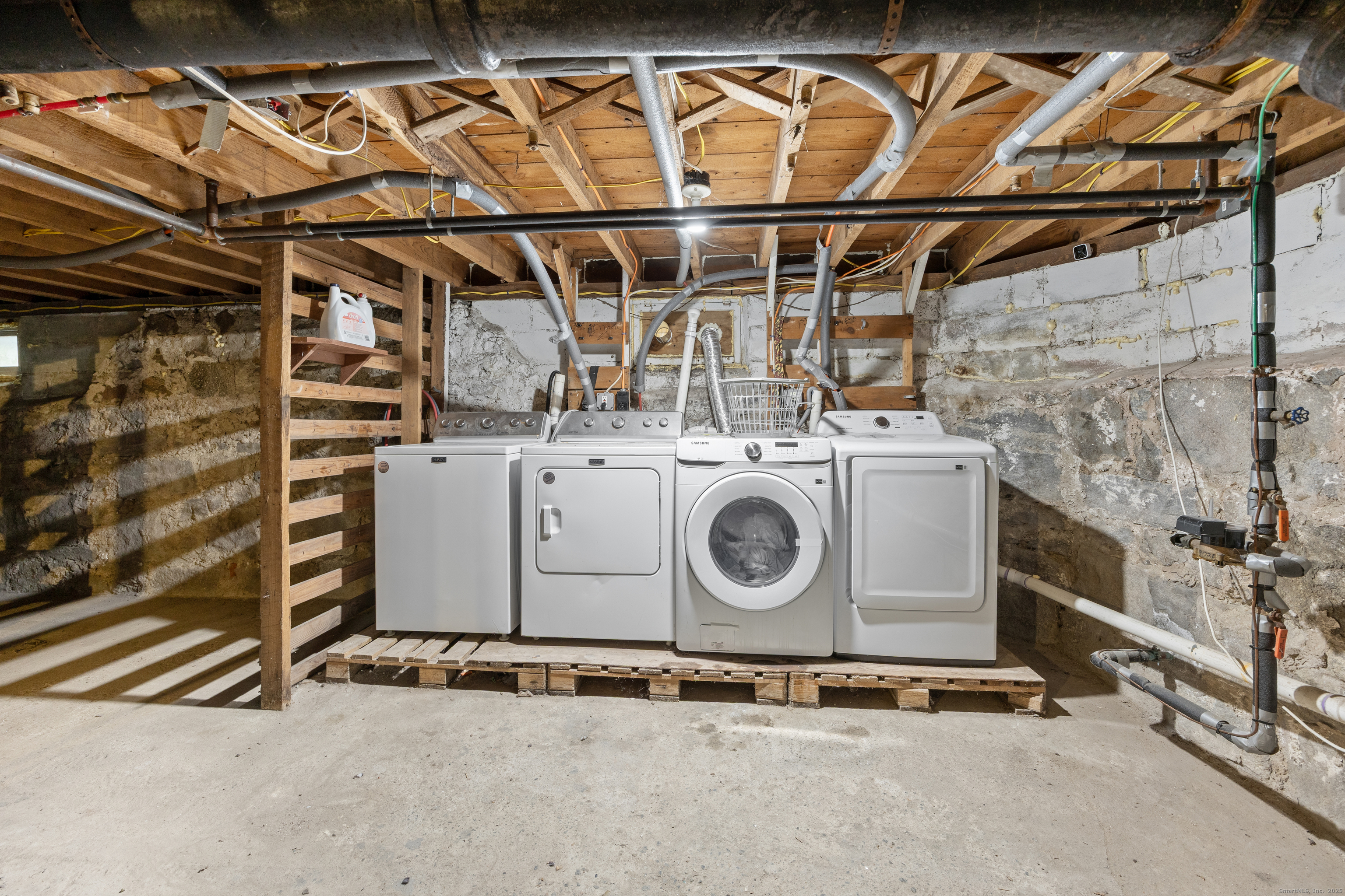 29 Berry Street Torrington, CT 06790 - Photo 23 of 31 a utility room with dryer and washer