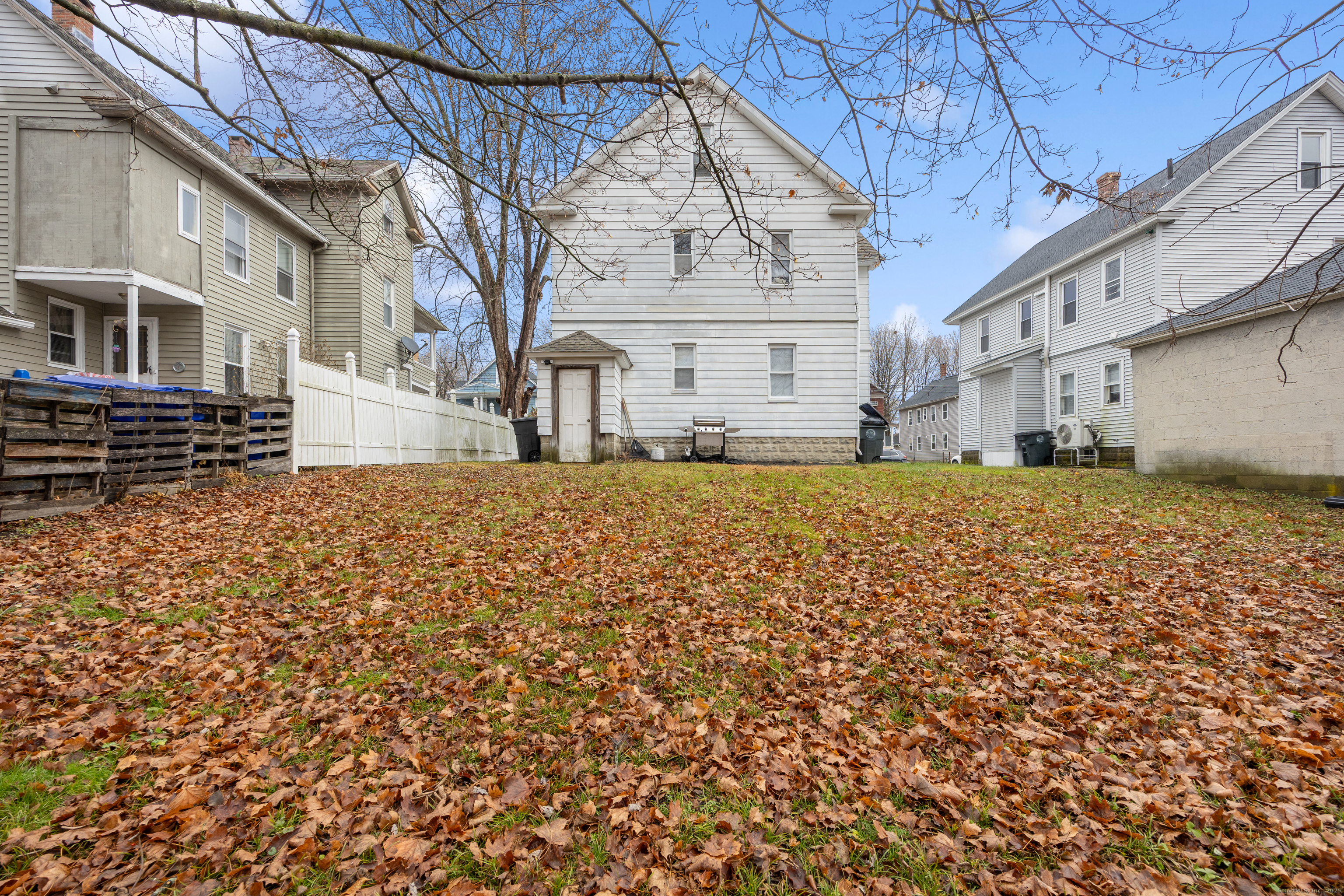 29 Berry Street Torrington, CT 06790 - Photo 26 of 31 a view of a building with a yard