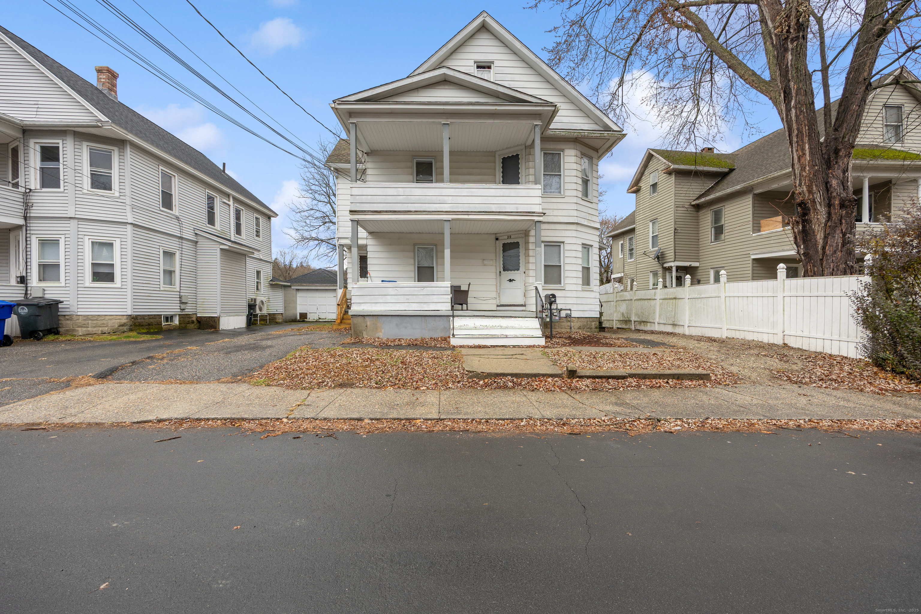 29 Berry Street Torrington, CT 06790 - Photo 3 of 31 a view of a white house with a large windows