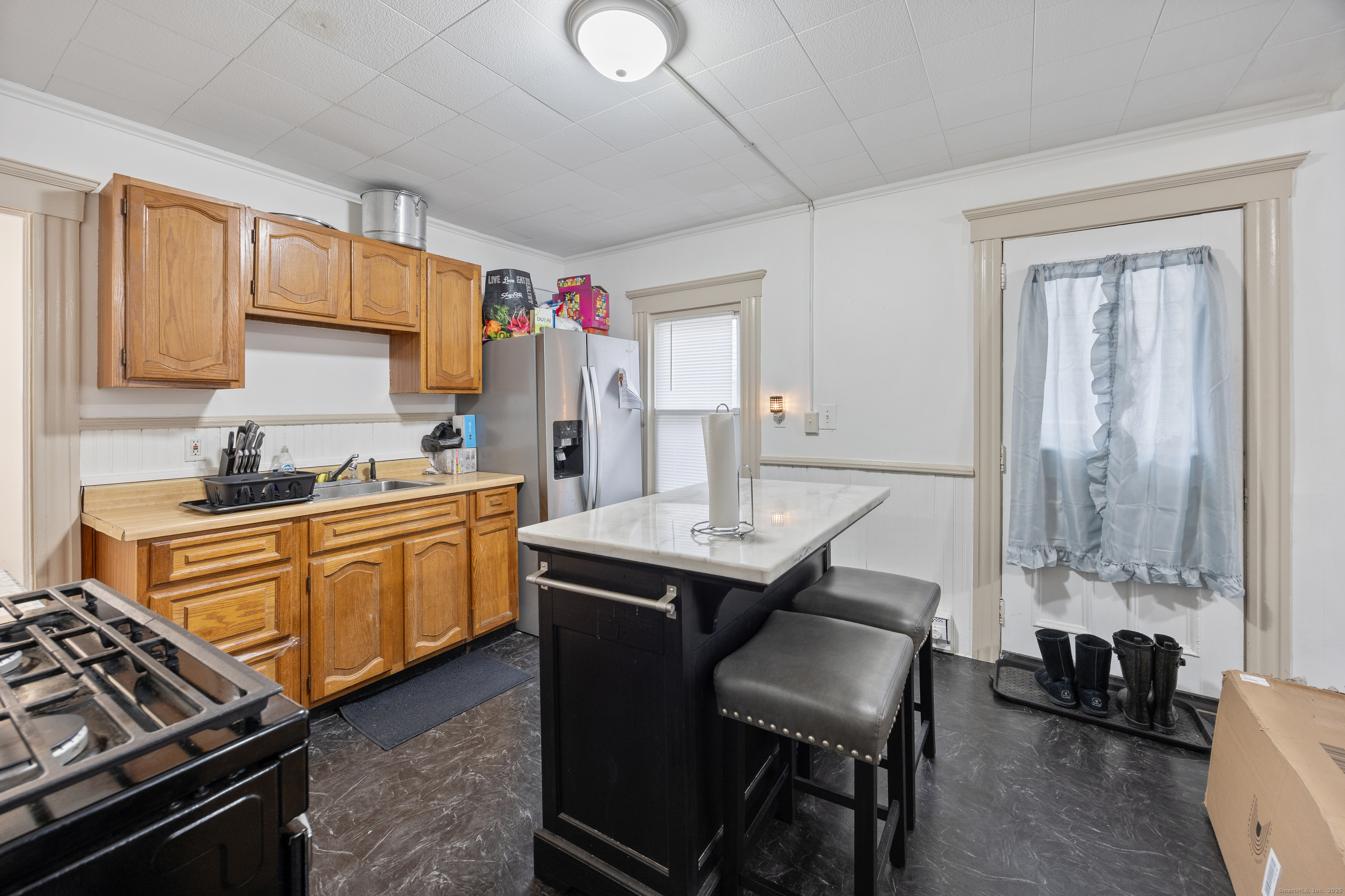 29 Berry Street Torrington, CT 06790 - Photo 5 of 31 a kitchen with sink cabinets and stove top oven