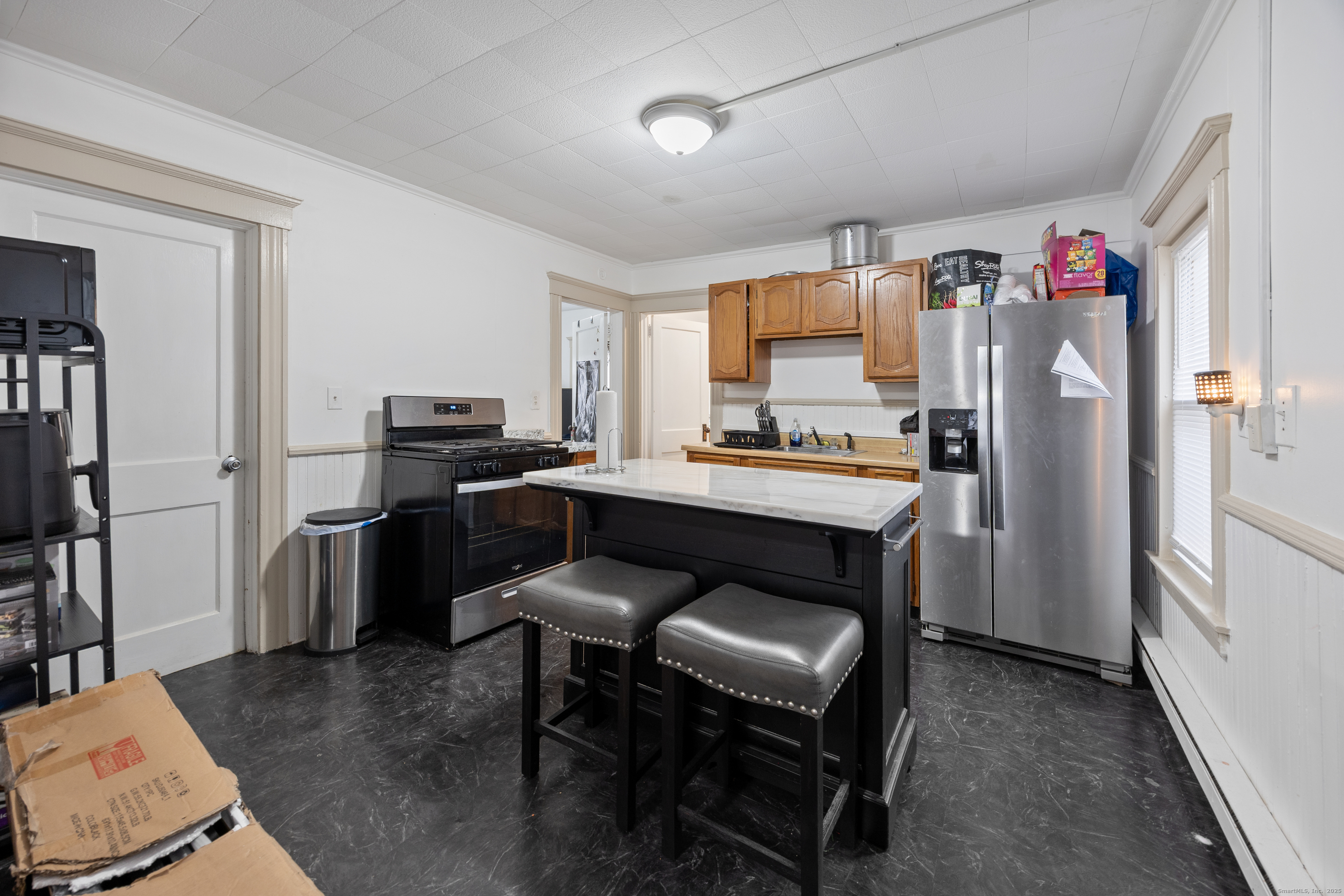 29 Berry Street Torrington, CT 06790 - Photo 7 of 31 a kitchen with a refrigerator a stove a sink dishwasher and a refrigerator with wooden floor