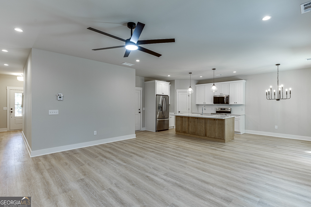 110 Rains Road Jefferson, GA 30549 - Photo 11 of 43 a view of kitchen with refrigerator and microwave