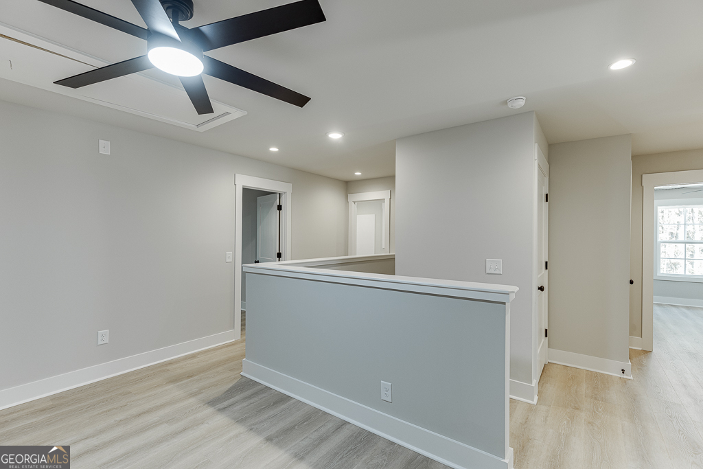 110 Rains Road Jefferson, GA 30549 - Photo 28 of 43 a view of an empty room with window and wooden floor