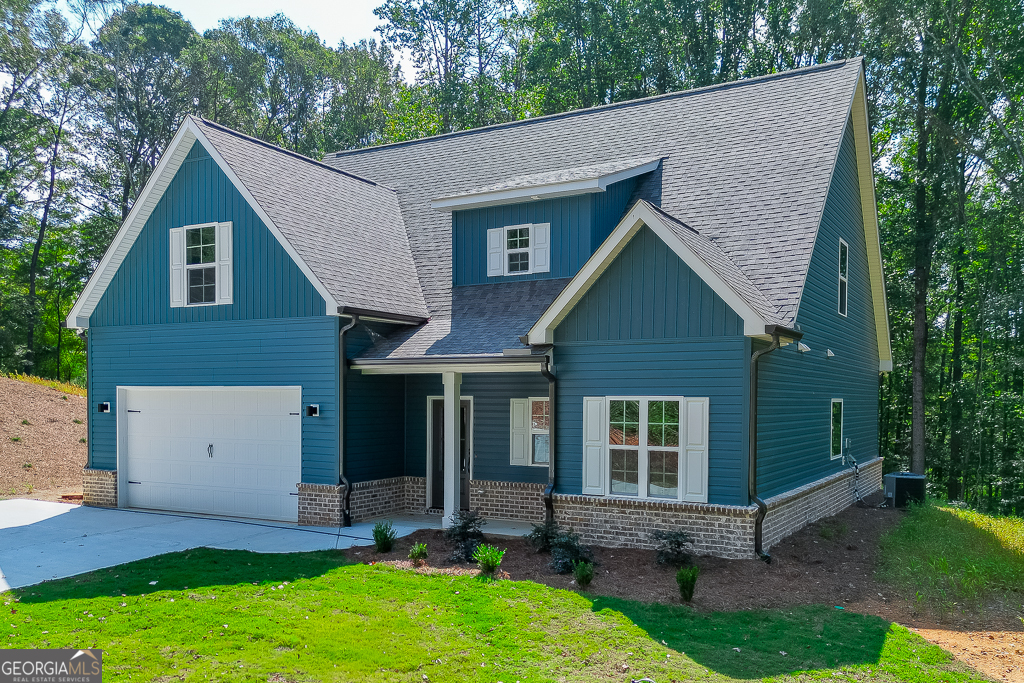 110 Rains Road Jefferson, GA 30549 - Photo 3 of 43 a view of a house with a yard plants and large tree