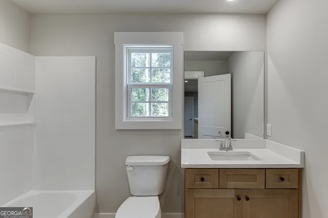 a bathroom with a sink toilet and a bathtub