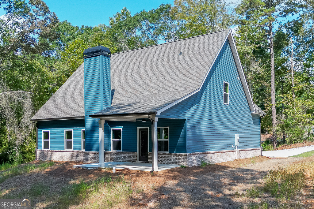 110 Rains Road Jefferson, GA 30549 - Photo 42 of 43 a view of a house with a yard plants and large tree