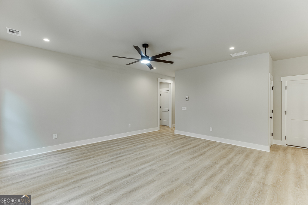 110 Rains Road Jefferson, GA 30549 - Photo 10 of 43 a view of an empty room with a ceiling fan