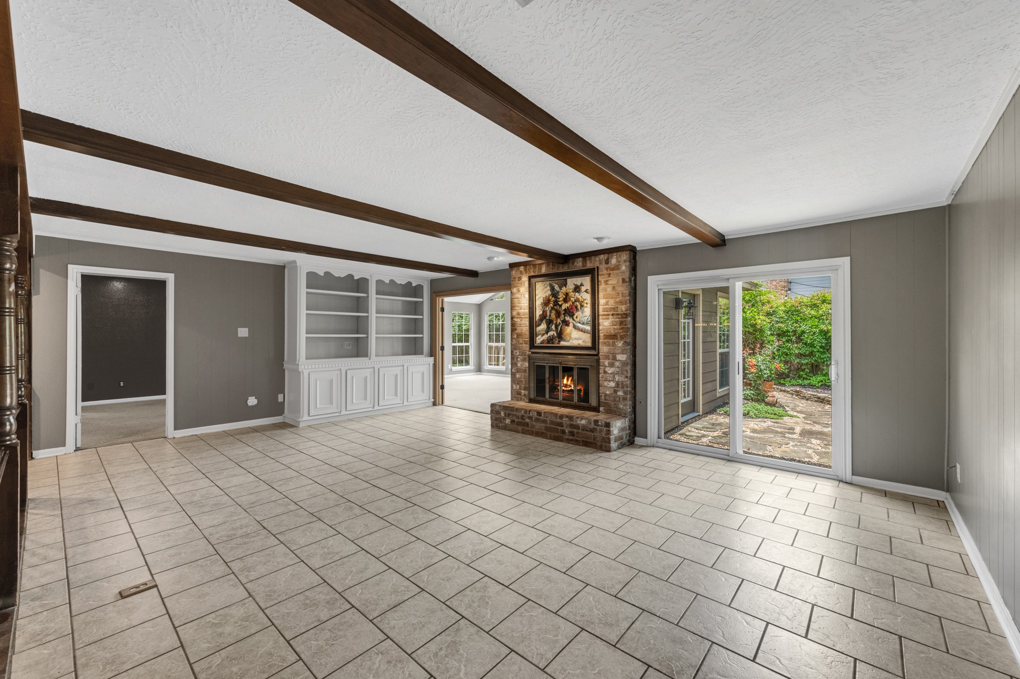 622 South Rivershire Drive Conroe, TX 77304 - Photo 22 of 44 a view of empty room with wooden floor and fireplace