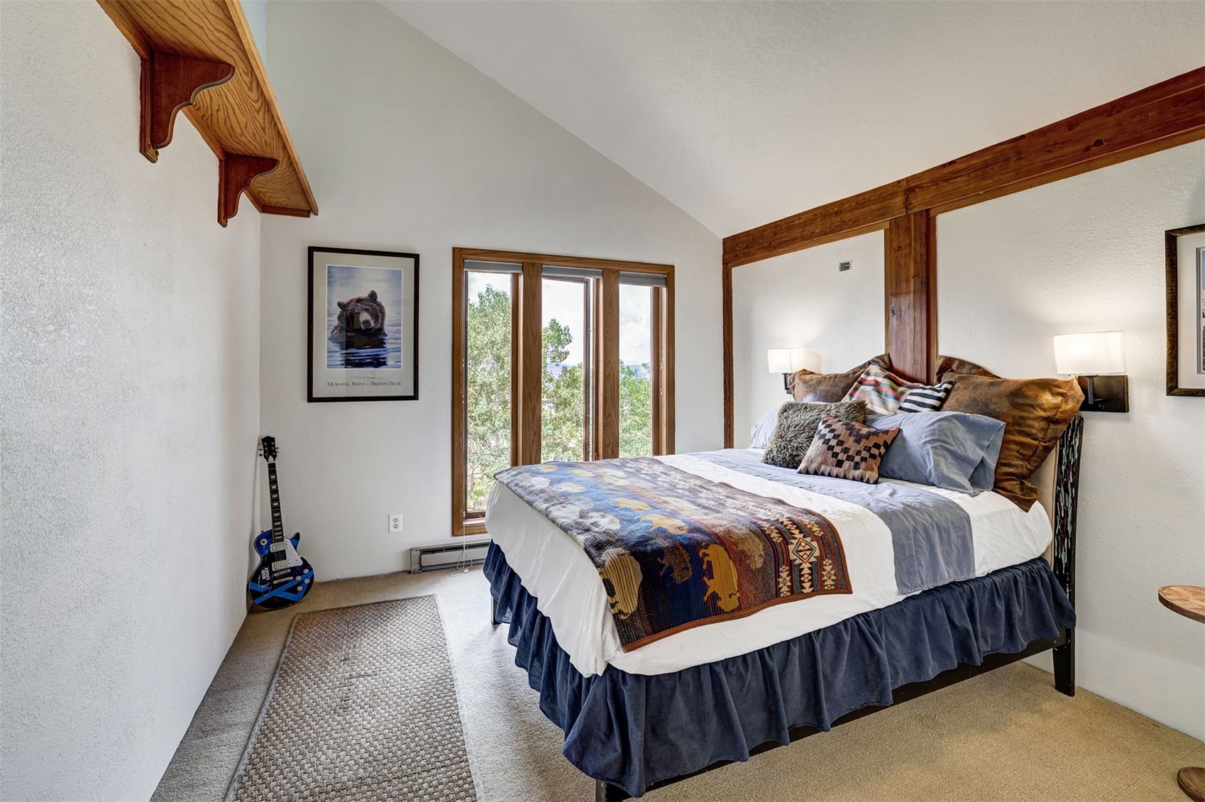 1703 Elk Run Road Silverthorne, CO 80498 - Photo 24 of 46 a bed sitting in a bedroom next to a window
