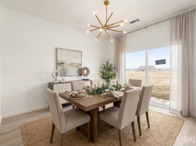 a view of a dining room with furniture and window