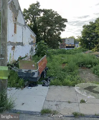 a aerial view of a house with backyard