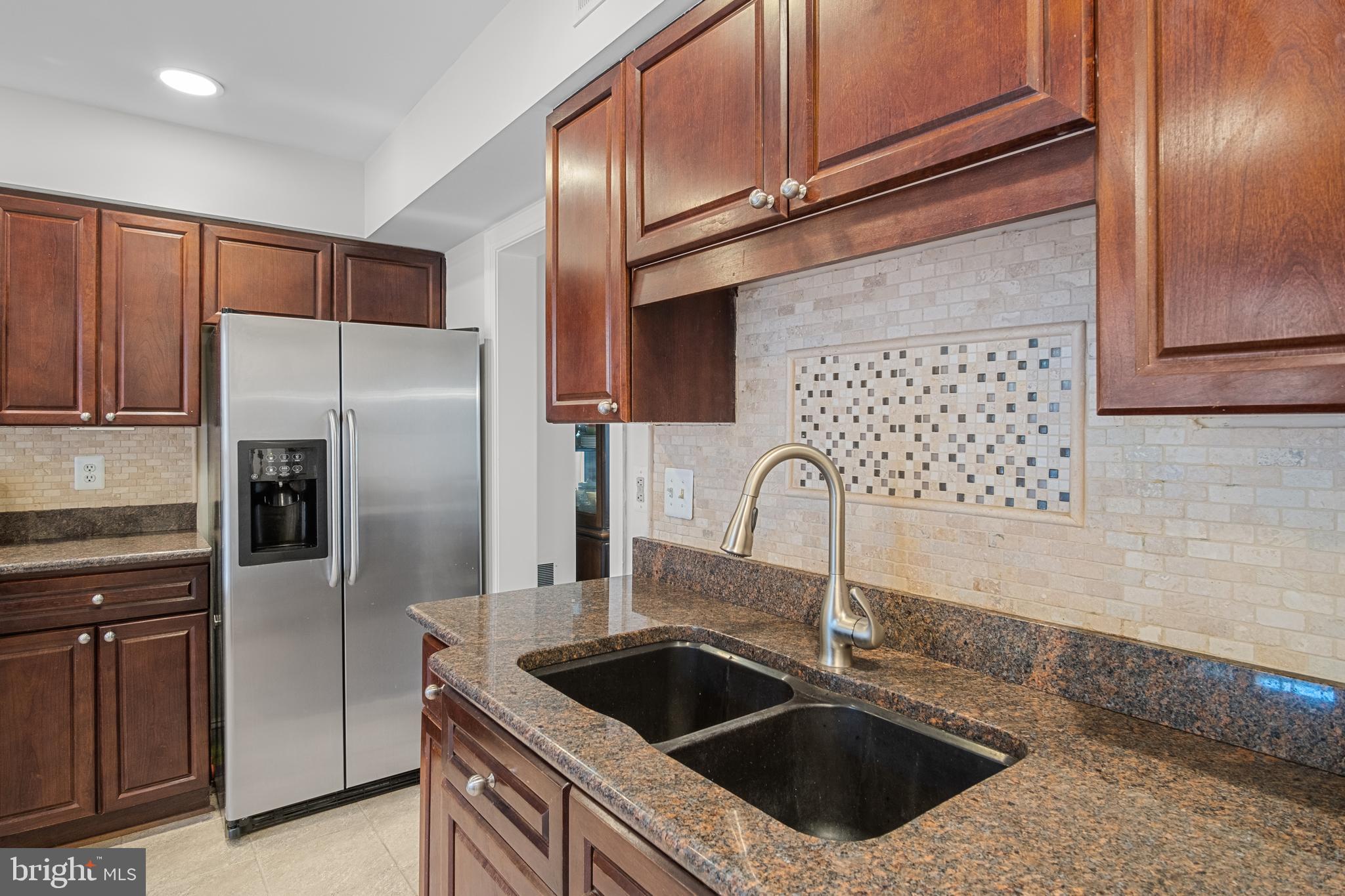 6532 Milva Lane Springfield, VA 22150 - Photo 8 of 57 Double Bowl Sink and Detailed Backsplash