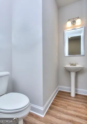 a view of bathroom with a sink and mirror