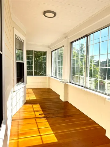 a view of empty room with windows