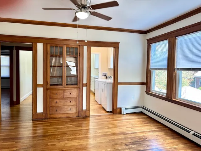 wooden floor in an empty room with a window