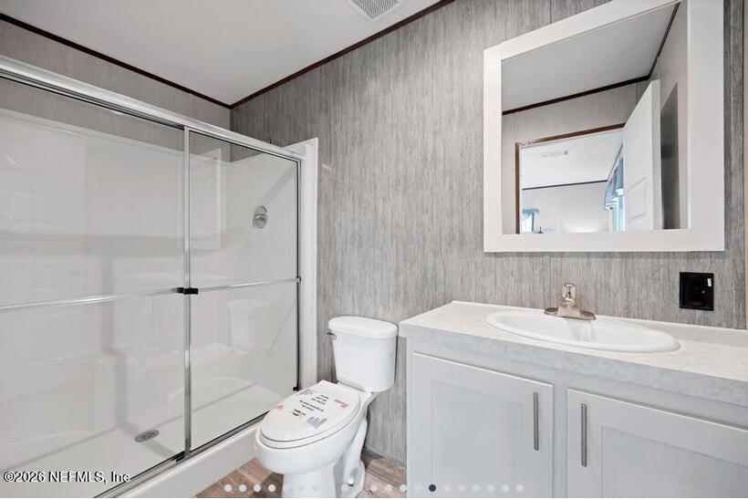 140 Islander Road Satsuma, FL 32189 - Photo 7 of 11 a bathroom with a sink toilet and shower