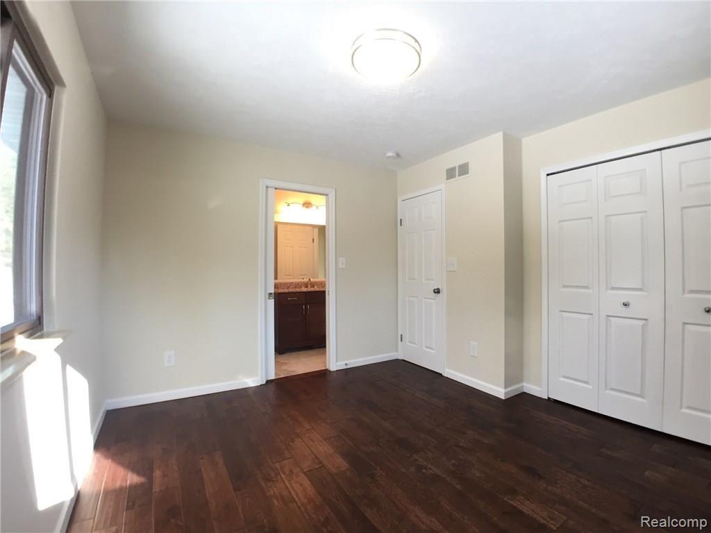 1160 Peavy Road Howell, MI 48843 - Photo 10 of 17 310 master bedroom backview IMG_7429_DxOVP.jpg