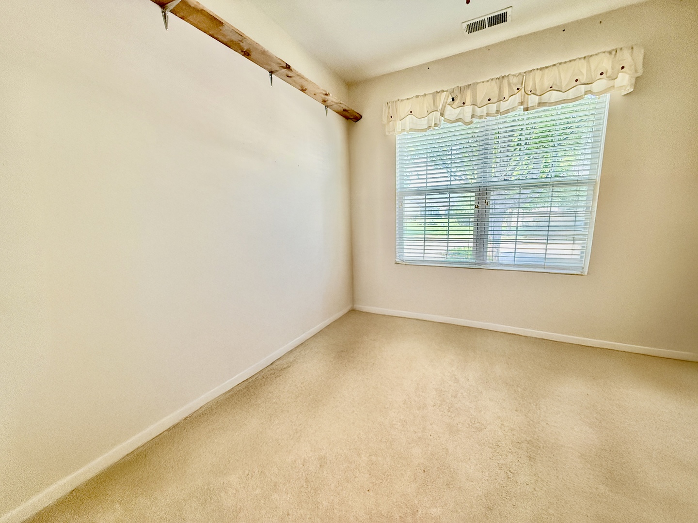 13455 Nealy Road Huntley, IL 60142 - Photo 13 of 16 a view of an empty room with a window