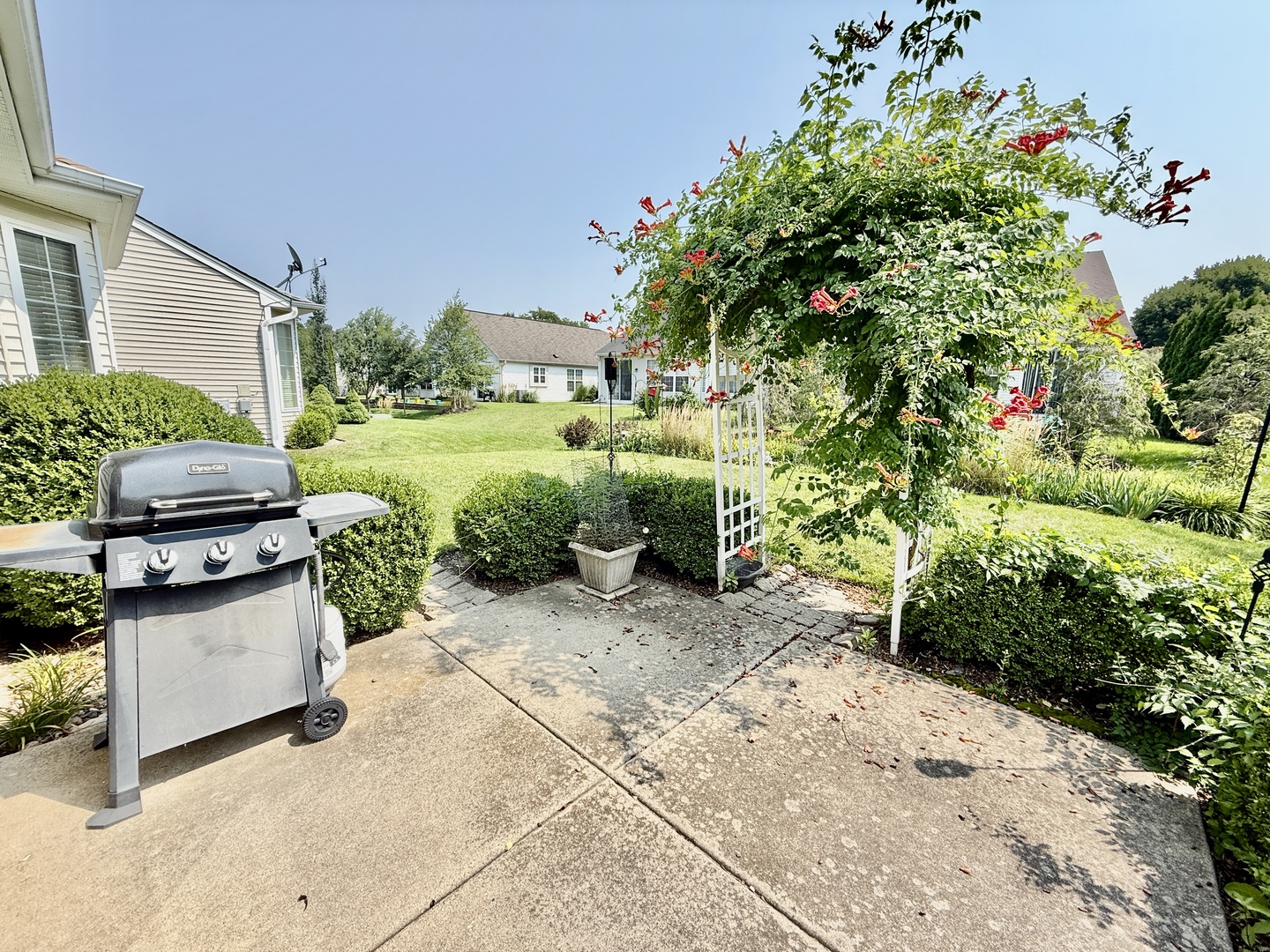 13455 Nealy Road Huntley, IL 60142 - Photo 16 of 16 a view of backyard with outdoor seating and flowers