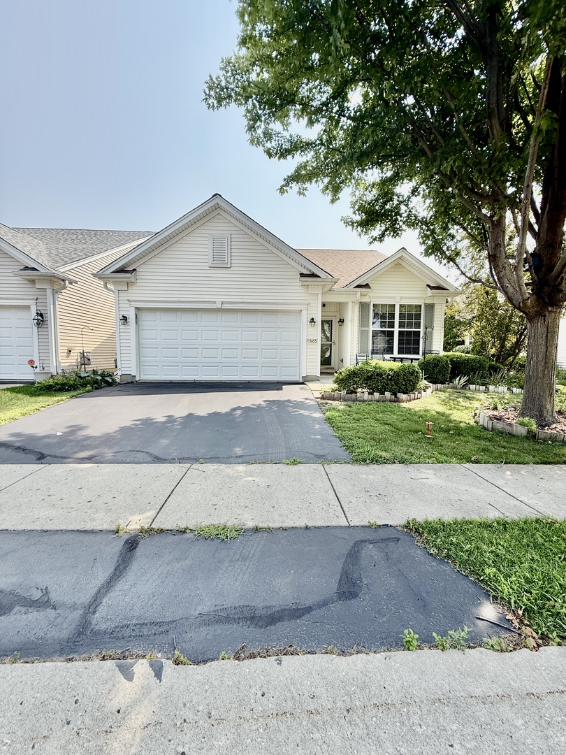 13455 Nealy Road Huntley, IL 60142 - Photo 3 of 16 a view of a house with a yard and large tree