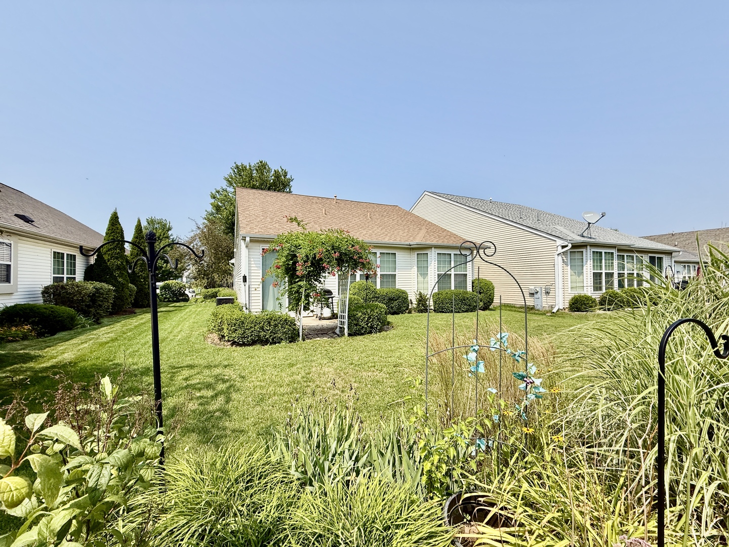13455 Nealy Road Huntley, IL 60142 - Photo 4 of 16 a view of house with garden and swimming pool